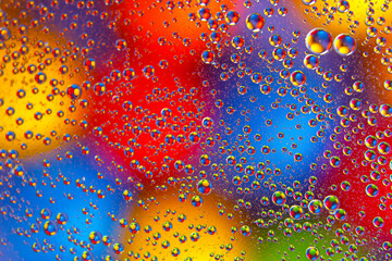 abstract colored balls of oily liquid on a blurred background. abstract background texture