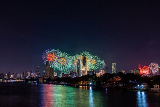 Amazing Thailand Countdown 2023 celebration with multicolor  firework display on Chaophraya River at Icon Siam, Bangkok city, Thailand
