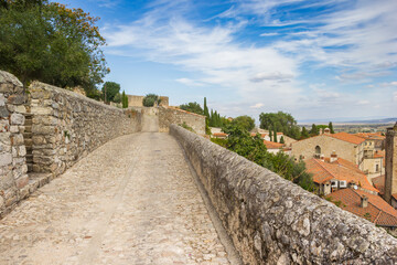 Fototapeta na wymiar Cobblestoned street leading to the castle of Trujillo, Spain