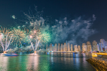 Fire work show between Jumeirah beach and blue water al ain wheel promoting Dubai Shopping Festival.