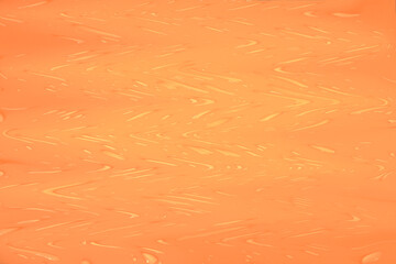 Defocus blurred transparent orange colored clear calm water surface texture with splashes and bubbles. Trendy abstract nature background. Water waves in sunlight with copy space. Red water shine