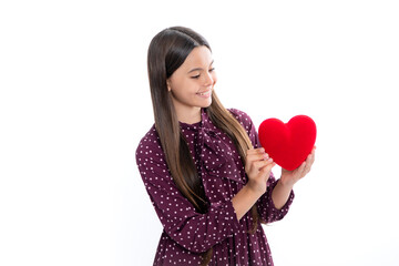 Teenage girl hold shape heart, heart-shape sign. Child holding a red heart love holiday valentine symbol, isolated on white background. Portrait of happy smiling teenage child girl.