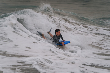 young bodyboarder surfs a wave in Gran Canaria. Canary Islands. Spain
