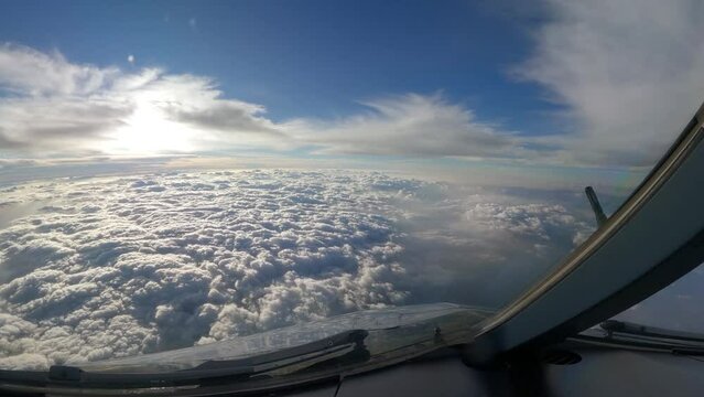 cockpit view of airplane clouds beautiful sky