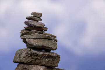 stack of stones with blue sky background