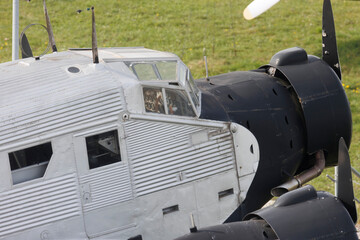 Cockpit and mid-engine of a three-engine old Junkers JU52 transport and traffic plane also called Tante Ju