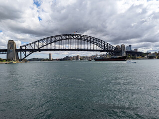Fototapeta na wymiar A view of the famous Sydney Harbour Bridge taken from beside the Opera House in NSW, Australia.