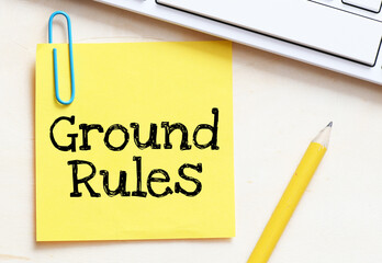 GROUND RULES words on a small yellow piece of paper.