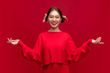 Young asian woman wearing red sweater dress with product presentation on red background for Chinese...