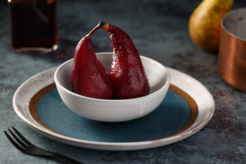 delicious red wine poached pears in spicy syrup
