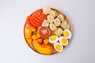 Healthy food Cabbage rolls stuffed with ground pork in a wooden tray white background top viwe