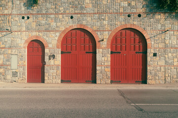 Three large red doors and walls