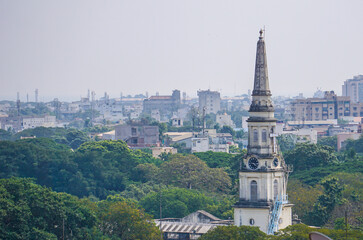 Fototapeta premium Church tower above city scape in India