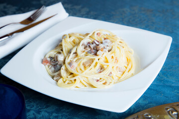 Carbonara pasta. Carbonara is an Italian pasta dish from Rome made with eggs, hard cheese, cured pork, and black pepper.