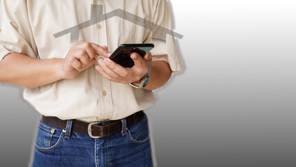 Male hand standing. Smartphone in hand. Gray background copy space image (focal point)