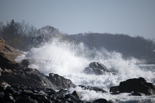 Ocean waves crashing on a rocky shore - Powered by Adobe