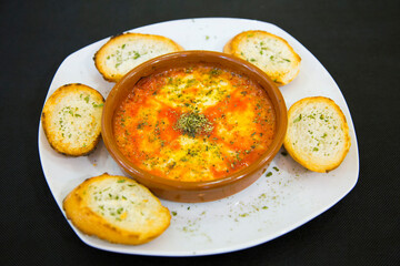 Provoleta. Provolone is an Italian cheese. It is an aged pasta filada cheese originating from Campania, near Vesuvius.