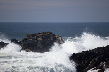 Ocean waves crashing against a rocky shore