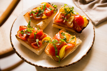 Bruschetta is an antipasto from Italy consisting of grilled bread rubbed with garlic and topped with olive oil and salt.
