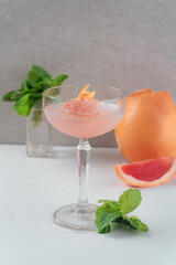 Glass with ice cream and pink champagne. Delicious drinks concept.
