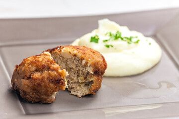 fried cauliflower burger with mashed potatoes