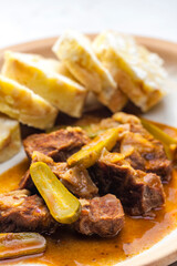beef meat with picles sauce and dumplings