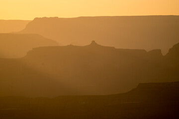 Sunset shadows over valleys of the Grand Canyon in USA, evening sunset silhouettes