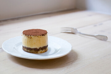 Italian tiramisu. Tiramisu is a cold cake that is assembled in layers. and has ingredients like cocoa, mascarpone and coffee.