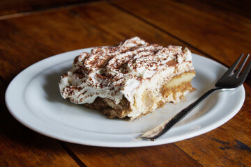 Italian tiramisu. Tiramisu is a cold cake that is assembled in layers. and has ingredients like cocoa, mascarpone and coffee.