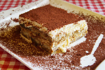 Italian tiramisu. Tiramisu is a cold cake that is assembled in layers. and has ingredients like cocoa, mascarpone and coffee.