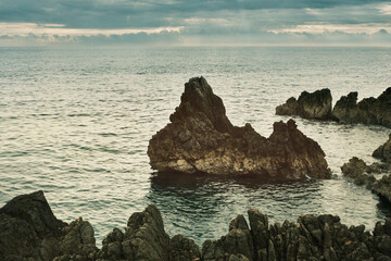 Small rock near the rocky shore