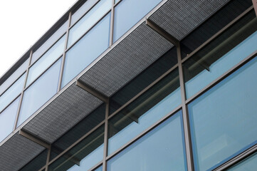 Fototapeta na wymiar building exterior with glass walls and galvanized steel walkway 