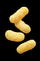 Flying corn sticks, isolated on black background