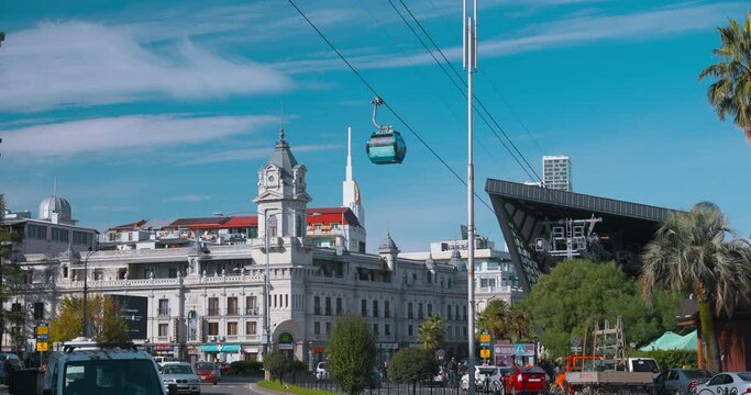 Colorful View On Cableway Argo Cable Car With Modern Urban Architecture Skyscraper In Batumi, Adjara, Georgia. Bright Blue Sky. Sunny Autumn Day. Bright Blue Sky.