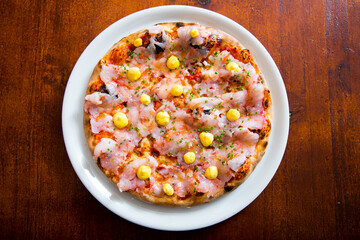 Pizza with shrimps. Neapolitan pizza made with mozzarella. Italian recipe.