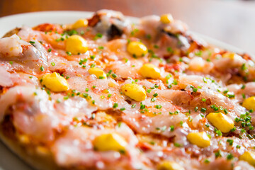 Pizza with shrimps. Neapolitan pizza made with mozzarella. Italian recipe.