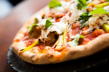 Pizza with meat and curry. Neapolitan pizza made with curry-spiced beef. Italian recipe.