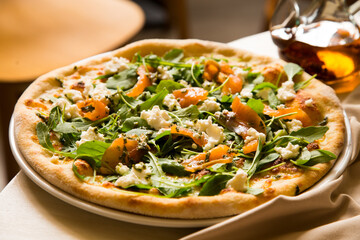 Salmon Pizza. Neapolitan pizza made with salmon and baked vegetables. Italian vegetarian recipe.
