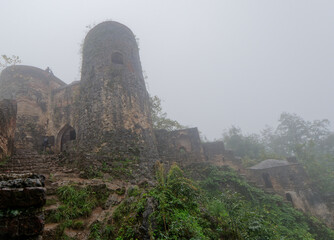 View of the walls of Rudkhan Castle on a misty rainy day, Gilan province, Iran
