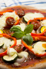 Pizza with vegetables. Neapolitan pizza made with baked vegetables. Italian vegetarian recipe.