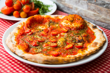 Pizza with vegetables. Neapolitan pizza made with baked vegetables. Italian vegetarian recipe.