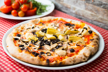 Pizza with vegetables. Neapolitan pizza made with baked vegetables. Italian vegetarian recipe.