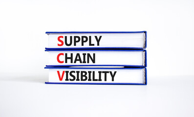 SCV supply chain visibility symbol. Concept words SCV supply chain visibility on books on a beautiful white table white background. Business SCV supply chain visibility concept. Copy space.