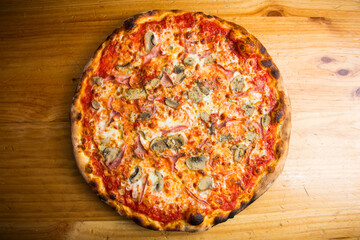 Mushroom Pizza. Neapolitan pizza with tomato sauce, cheese, ham and mushrooms. Authentic Italian recipe.