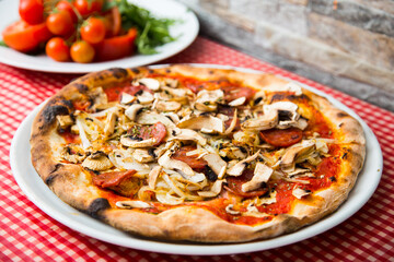 Mushroom Pizza. Neapolitan pizza with tomato sauce, cheese, ham and mushrooms. Authentic Italian recipe.