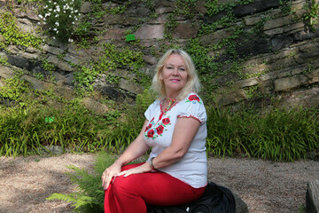 person sitting on a stone
