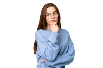 Teenager girl over isolated chroma key background thinking an idea while looking up