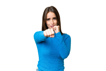 Young beautiful woman over isolated chroma key background with fighting gesture