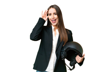 Young Asian woman with a motorcycle helmet over isolated chroma key background with surprise expression