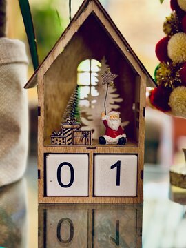Calendar Toy with Santa Claus holding a magic star